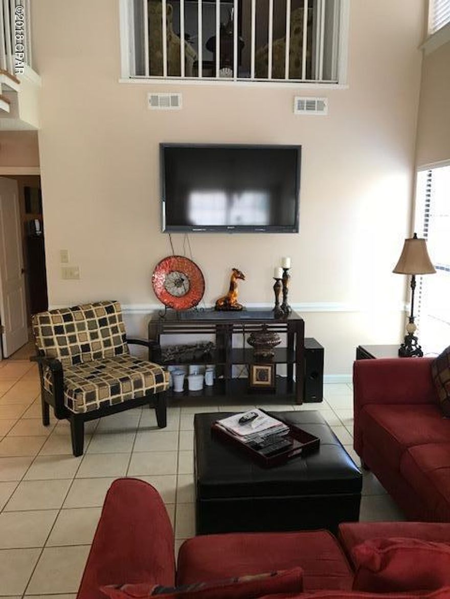 Great 2 Bed, Bath Condo completey furnished  and a non-rental. The updates included new AC, floors are all tile, granite counter tops and hardwood steps on stairs. Furnished with wall mounted flat screen TV's and great sitting and sleeping furniture. Excellent rental potential or second home. Call today for your personal tour.