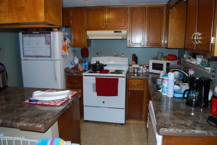 CURRENTLY UNDER CONTRACT, SELLER ACCEPTING BACKUP OFFERS. 2 Bedroom 1.5 bath townhouse close to Rutherford High School and Transmitter Road.  New roof after the storm, new front door, and newer dishwasher.  Enclosed back porch and fenced back yard.  Tile and laminate floors.  Currently on lease that expires March 31, 2022 and then will be on a month to month.  This would make a great home or investment property with tenant already in place.