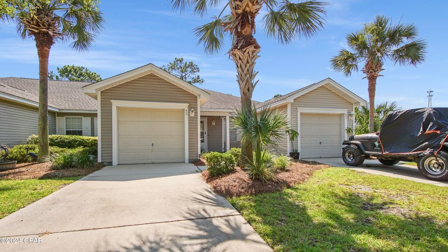 Beautiful 2 bedroom 2 bath townhome in Palmetto Trace!  This beautiful home features a spacious open floor plan with ceramic tile in the kitchen, bathrooms and entry way.  The patio overlooks the woods with plenty of wildlife to watch. It includes steel hurricane storm panels. 
 Palmetto Trace features two community pools. This home is approximately 3/4 of a mile from the white sand beaches and a short golf cart ride to Pier Park.  Please check all HOA info and room measurements if important.