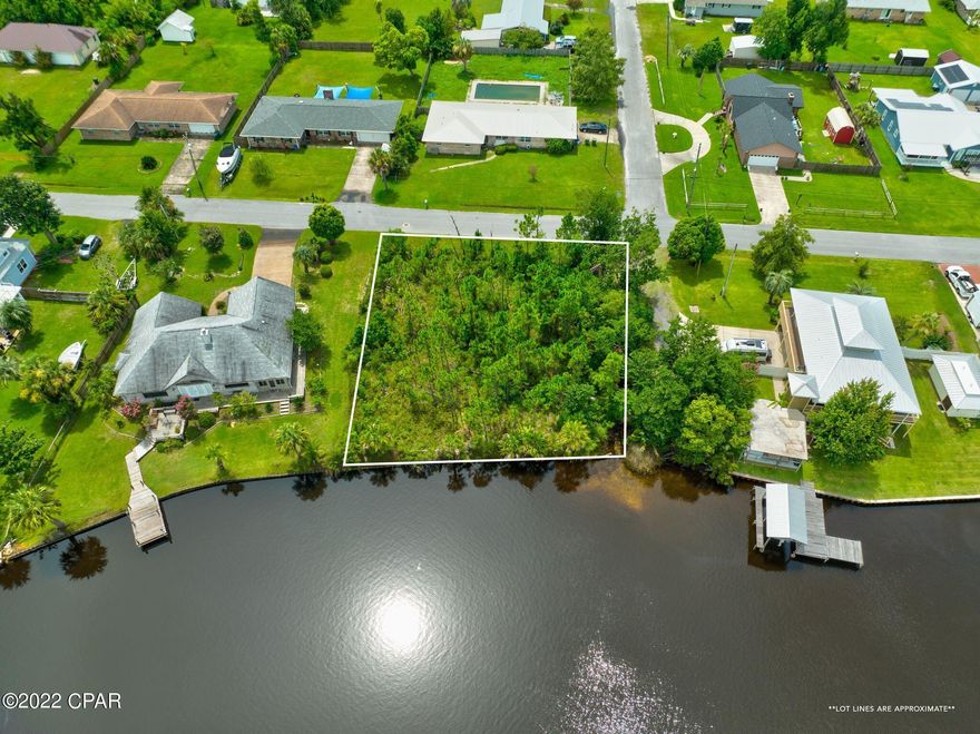CURRENTLY UNDER CONTRACT, SELLER ACCEPTING BACKUP OFFERS Location! Location! Location! Build your dream home on this amazing waterfront lot in Lynn Haven that already has a seawall.  Close to everything. Bring all your toys....no HOA. Golf cart friendly area. A. L. Kinsaul Park is just a short walk or golf cart ride away.

Neighbors say that you can see dolphins in the canal.