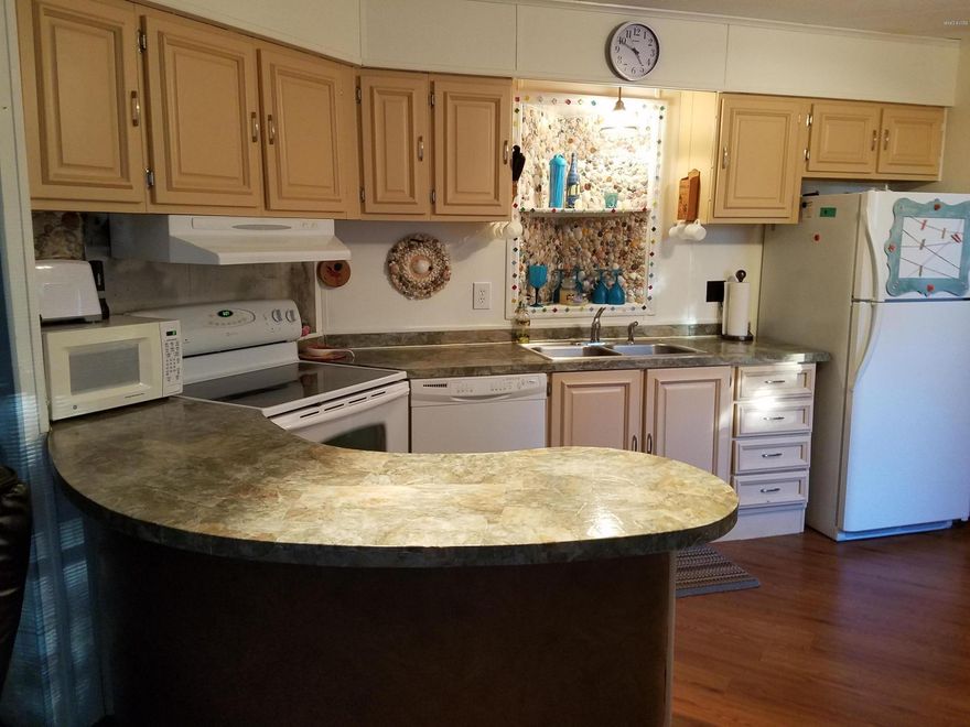 FURNISHED! There is a 3rd bedroom added on to this mobile home with a separate entrance. Full size washer and dryer included. Screened porch, large lot, non HOA. Store your boat or RV. Fenced lot