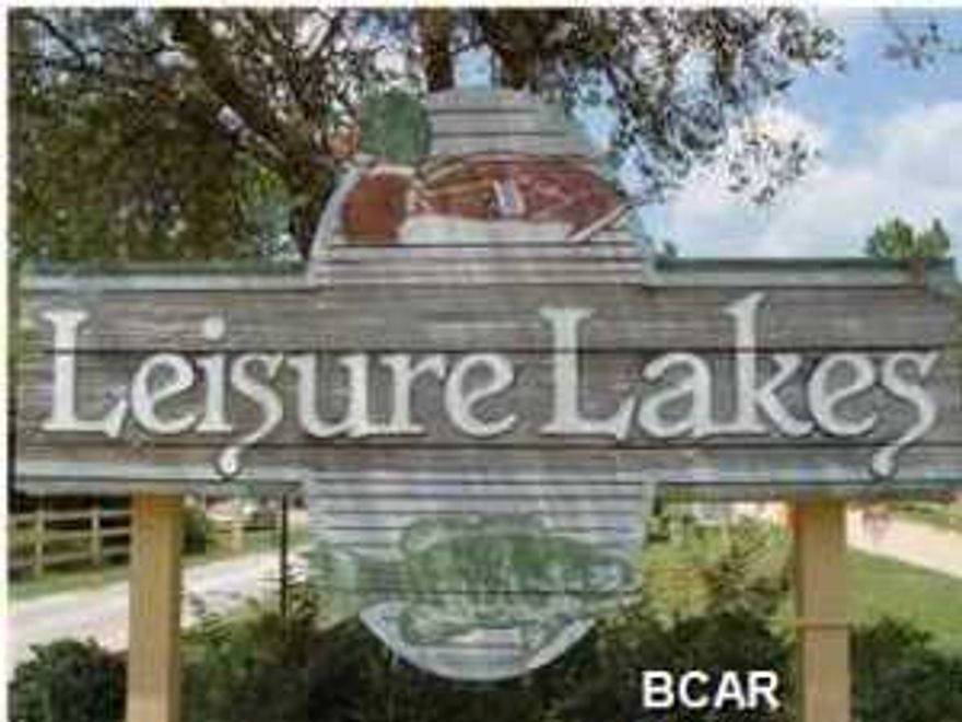 What a price to own acreage in Leisure Lakes Lakefront Community!! This lot is 3.66 acres and you can even have horses in Leisure Lakes!!Lots next door 8.66 acres for $42,000 asking price if you need extra acreage! Just 1/2 hour North of Lynn Haven, this GATED community has two spring fed lakes, a lakefront swimming pool, huge pavilion for cookouts and family gatherings,tennis and basketball courts and even a playground for the kids. Boat launch with great bass and bream fishing in these lakes! Electric motors only are allowed and underground utilities make this community one of the most peaceful places to live anywhere!! Imagine being able to relax on your porch and look up at the stars with no lights around! Homeowners dues are just $250.00 per year! Roads are maintained by