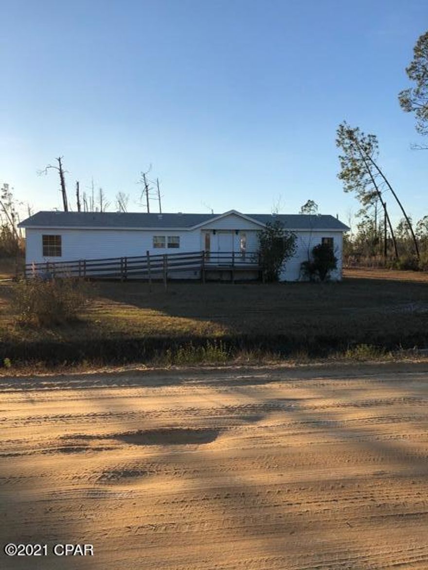 This amazing spacious three bed, two bath mobile home that sits on 2.39 acres of land could be a great starter home for the perfect family. This home has a lot to offer with all the backyard space for out door activities and potentially a pool. If you've been looking to find your peace and quiet where you can have your own space and privacy this would be an ideal home for you and your family. All the rooms are spacious with nice size closets and the master bedroom features a huge walk in closet for his/her and a garden bathtub that has built in jets. The kitchen has a ton of cabinet space which includes a pantry. It also has new laminate floors and the roof was replaced 2 years ago.