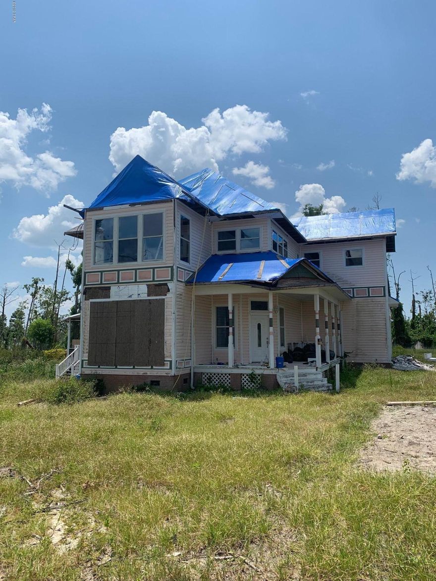 CURRENTLY UNDER CONTRACT, SELLER ACCEPTING BACKUP OFFERS Hurricane Damage. Property has been cleared of trees, gutted to studs, and roof tarped. finished this would make an amazing home in a great area of Lynn Haven and could appraise when finished above $300k.