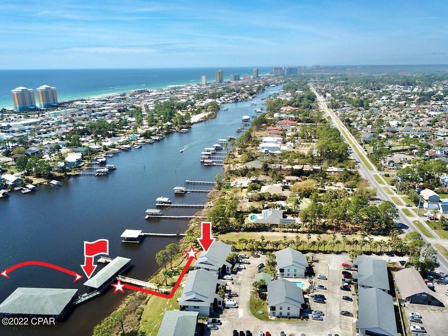 ATTN:  BOAT & BEACH LOVERS!  STOP & READ!  Don't miss this very Limited & Rare Opportunity to Buy & Enjoy the BEST of ALL features here! OWN your Deeded, Covered Boat Slip & Lift ($50K+ Value alone) & this Meticulously Updated 'WATER LAGOON FRONT' Furnished ground floor Unit! Walk to your Slip from the back door! Enjoy Captivating Views & Sunsets in this Upscale 'Coastal Luxury meets Beachy Chic' Condo, $80K Remodel, PLUS an additional $50K Valued Boat Slip! All custom slow-close Cabinets, Quartz Countertops, LVP Floors, Shiplap & more! Move-in ready, where you'll find the perfect balance between Waterfront Living & the Boat-Beach Life, 5 minutes away from Crystal Blue Beaches, Islands, Fishing & Dockside Dining @ local favorite Restaurants! Get ALL of this under $500K! The BEST DEAL in PCB FL, Close to Shopping, Restaurants, Spas & everything you could need, enjoy and so much more! Covered, Privately Owned Boat Slip #5, with a Lift is being Sold with this Sale (for an approx. $50K Value, per Slip) and a separate Bill of Sale for Purchase Value and Transfer of Ownership to the New Buyer is signed by both parties and completed at Closing!  Should the New Buyer not desire the Boat Slip for any Listing where the Owner has one, the Seller may reduce the List / Sales Price, negotiable for up to $50K and the current Seller / Owner may Sell the Boat Slip separately from the Sale. All 22 Owner's of Boat Slips purchased these separately when the Dock was rebuilt and are transferable with a Bill of Sale completed and signed at Closing or they are Sold separately to Owner's within the Community with Bill of Sales, which is the reason why these Private Boat Slips ADD approx. $50K of CONTRIBUTORY VALUE, over and above the Sale of the Unit, with Seller's who Own One ( There are 22 Boat Slips in Total and 54 Units in Greenwood Estates ). Which makes this Unit Listing even more attractive to gain additional equity! Never Rent a Boat Slip Again! Monthly HOA costs less than what you would pay to rent a Boat Slip with ZERO added Equity or Contributory Value when you have your own to use all year long or may choose to Sell it down the Road to a Community Owner! Bonus: Boat Slip Owner's only have to pay a ONE TIME Annual Amount of $175 to HOA for Environmental Dock Lease Tax, Security Gate and Camera's with Code needed for Dock entry and Water and Electric access also available for each Boat Slip (22 Slips Total)! Aside from this, Monthly HOA/MCOA covers everything but Electricity and Internet! Inside Contents "HO6 Insurance" may be optional and should be discussed and verified with Buyer. An additional LARGE Lattice storage space can be utilized underneath the unit to store anything that suits your lifestyle, such as Kayaks and Canoes! New Roof & Storm Grade Windows also added, the end of 2020! Thoughtfully upgraded with Class, Style & Custom finishes throughout! The Seller's are ok with selling Unit fully Furnished, including all appliances, W&D and everything in the Kitchen & Cabinets (minus a few sentimental items, noted in MLS &/or few items already removed from Unit). There's so many amazing things to mention, so schedule your Showing ASAP and come see for yourself! THERE IS LIMITED INVENTORY LIKE THIS IN GRAND LAGOON AND DOESN'T COME UP FOR SALE OFTEN! DON'T MISS OUT ON OWNING A LAGOON WATER FRONT UPGRADED UNIT THAT COMES FURNISHED WITH A YOUR VERY OWN DEEDED BOAT SLIP W/LIFT! THESE SLIPS ARE DESIGNED TO HOLD UP TO 30 FT BOATS, AND UP TO 10,000 POUNDS! FOR SLIP #5, ALL YOU NEED IS AN ADDITIONAL SIDE MOTER/LIFT TO ACHIEVE THIS! OWNER HAS HAD A SMALLER CUSTOM FISHING BOAT IN SLIP, LIVING THE FISHING AND BOAT LIFE AT IT'S FINEST!