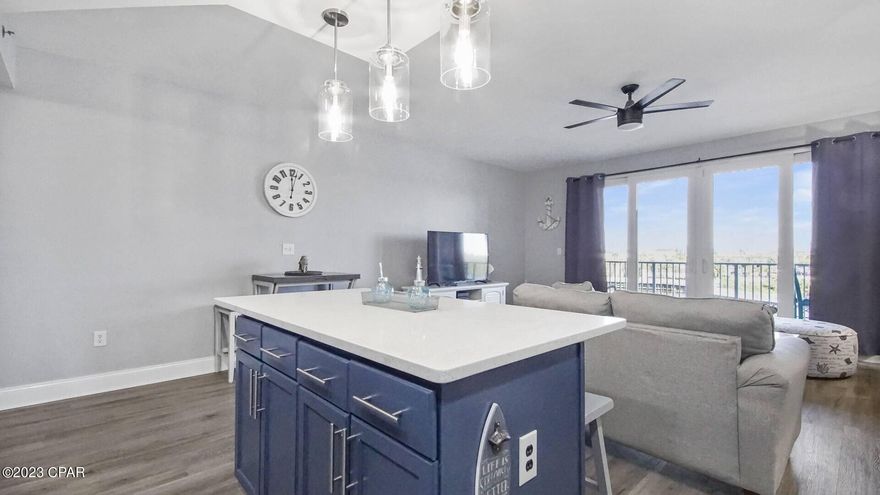 Words almost can't describe this renovation!! It has to be one of the most beautiful condos at Laketown Wharf!! And for you low floor lovers that really don't get too excited over elevators, this one solidifies that this one is yours!! Just to name a few upgrades. They include Luxury vinyl flooring throughout, entire condo was freshly painted to perfection with coordinating appeasing to the eyes and emotions, custom painted kitchen cabinets and new hardware, new deep kitchen sink, Quartz counter tops, new kitchen appliances, new hardware and quartz counter tops in the bathrooms, new furniture and furnishings, new window treatments and only a couple of years old HVAC and water heater. Very relaxing view of the Lake and water shows from your spacious balcony and high end furniture. Very large Living area with room to roam around and how could you not crave having a center kitchen island with bar stools. This unit has a nice size bedroom with its own bath and a bunk room and closet/storage space with its own bath right across from it. Laketown Wharf is across the street from Pineapple Willies and the World's Most Beautiful Beach and even a walkway over the Lake to go directly to more eateries, Walmart and Walgreens. Laketown Wharf also has its own secure, coded boardwalk leading right onto the beach. In the resort, you will also find some neat shops and Eateries that are really good!! We don't want to forget about the Two Level Gulf front Fitness Center, covered garage parking, 52,000 sq ft of Lakefront Boardwalk and of course, the 5 Unique Pools.  All of these amenities plus such an outstanding unit equals rental income!! Call your favorite Realtor today and come view this one!!