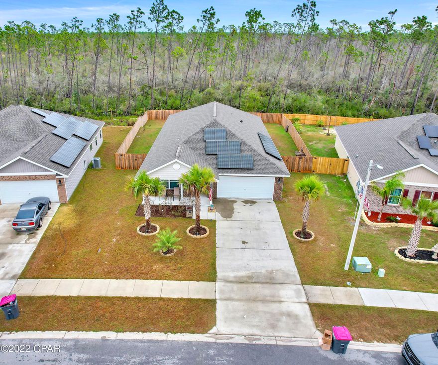 Beautiful 4 bedroom, 2 bath home built in 2019. This home is immaculate! When you walk through the front entry way you will find LVP floors throughout the common areas. The 2nd bathroom has LVP flooring and a shower/tub combo and vanity. The home also features 1 bedroom with LVP flooring, that acts as an office if needed. The living room area is large with an open concept, that opens into the kitchen and dining area. The kitchen features an island, and plenty of cabinets for storage. Appliances include: Microwave, dishwasher, refrigerator, and range. The living area has access to the covered back porch, that is roomy enough for dining and seating area for entertaining.  As you enter the large master suite you will find plenty of space and walk-in his and her closets. The master bath has a tiled shower and a double vanity. Magnolia Hills is one of the newest home communities, conveniently located near shopping and schools. This home also is powered with solar panels! Power bill is non-existent! This lot has been cleared all the way to the property line, creating a much larger backyard than most other homes. Home is on city sewage and city water. This charming community offers privacy and quick access to HWY 231. This almost brand-new home will not last long!