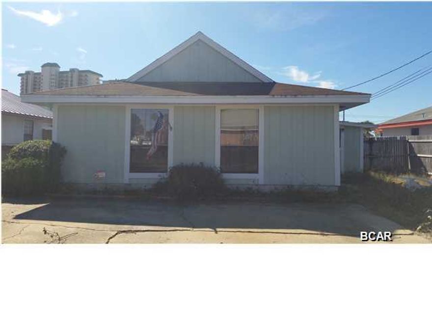 PRICE REDUCED DOWN 25,000! Welcome To The Worlds Most Beautiful Beaches! Motivated Seller, bring your offer! This home is a 2 bedroom 1 and a half bath in need of some work. Custom built solid oak cabinets in kitchen. Screened in porch and sliding glass doors that lead to a covered patio and completely fenced in back yard. This home would make a great vacation home, investment property or starter home. This home is in a great location and is walking distance to the beach. PLEASE DO NOT MISS OUT ON THIS GREAT PRICE! Come and enjoy beach life for less!