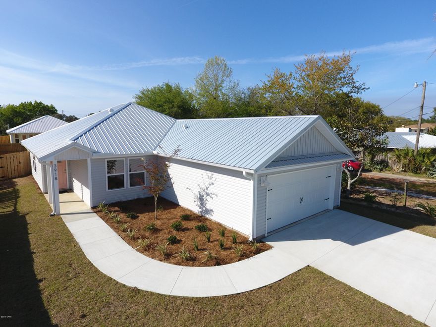 New construction, Great Location!  1 block from the Safari street boat ramp and 3 blocks from the beach!  Walking into this warm and inviting home, you will love the efficient, open floor plan by Fineline Home Design. Treyed ceilings, recessed LED lighting, custom designer colors with accent painted doors, and ample natural light. The lovely and functional kitchen is well equipped with Stainless Steel appliances, white shaker soft-close cabinets, quartz counter tops, glass tile back splash, overlooking the spacious living/family room. Master bedroom is spacious with treyed ceiling and built in multi purpose cabinetry. The master bath has double vanities and the shower is tiled floor to ceiling with a glass door.  No carpet to deal with, there is gorgeous plank style solid surface floors throughout.  Full sized two car garage with automatic wi-fi enabled opener and decked overhead attic storage.  A spacious back deck is perfect for grilling in the privacy fenced back yard.  The lot is fully sodded and privacy fenced with a multi-zone wi-fi enabled irrigation system.  The home directly behind this, 3917 Safari, recently sold for $202.96 per sq. foot.