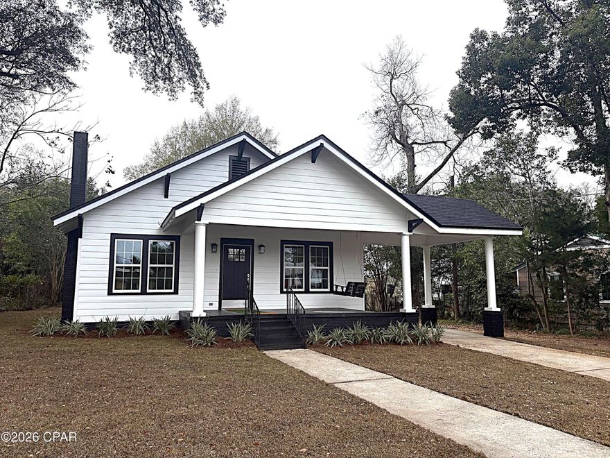 Beautifully restored 1936 Craftsman home offering 1,592 sq ft of living space and 1,928 sq ft under roof. This 3BR/2BA home sits on a .33-acre cleared, partially fenced lot with city water, sewer, and garbage service.

The home has been fully rehabilitated with strict attention to period-appropriate detail, preserving the original charm while offering modern efficiency. Essentially rebuilt from the walls, no expense was spared. From the crystal doorknobs and shaker-style trim to the open-concept layout, this home blends historic character with today's comforts. Renovation was completed by a licensed local general contractor, with all work permitted and approved by City and County Building Departments.

Exterior improvements include: new roof with 30-year architectural shingles, new fascia and wood as needed, factory-painted black aluminum drip edge, full exterior prep and Sherwin-Williams paint (white with black trim), painted foundation with new vents, fully caulked lap siding, epoxy-painted front porch, new solid-core shaker front door, all-new exterior lighting, added exterior outlet, new French drain system, new topsoil and grading, complete yard clearing, Centipede sod in front and sides, new insulated tilt-out vinyl windows with screens, and a black front porch swing (conveys).

Interior updates include: new high-efficiency SEER-rated HVAC, leveled floors with new joists as needed, new plywood subfloor with vapor barrier, luxury vinyl flooring throughout, interior gutted to studs, removal of center wall to create open concept with structural beam, full foam insulation (R11 walls, R30 attic), new drywall with knockdown texture, two-tone Sherwin-Williams paint, all-new solid wood shaker trim, original boxed window and door trim preserved, solid wood shaker cabinets with soft-close drawers, oversized kitchen island with seating, granite countertops, KitchenAid stainless appliances, complete new plumbing, complete new electrical system, and a tankless water heater.
Bathrooms were fully rebuilt with ceramic tile, new plumbing fixtures, new toilets, sinks, and vanities, and frameless tub and shower enclosures.

Ceramic tile surrounds both fireplaces, each featuring a new wood mantel and ready for gas log conversion.

This is a rare opportunity to own a historic Craftsman-style home with modern construction, efficiency, and peace of mind.