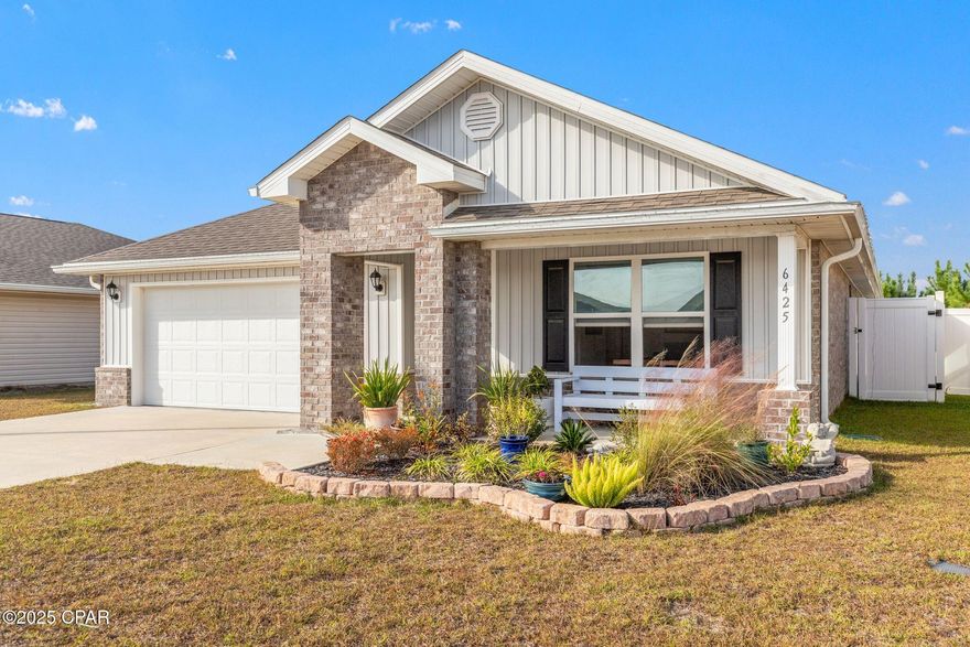 You've got to see this one to appreciate what makes it different. This early-phase Liberty home offers the kind of features buyers actively search for but rarely find together: a brick exterior, a private backyard with a natural conservation area directly behind the property, and no rear neighbors. Built in 2023, the home delivers a sense of calm, quality, and everyday ease that's immediately felt the moment you arrive. A thoughtfully designed butterfly garden near the front of the home adds a welcoming, personal touch and enhances curb appeal.

Inside, natural light fills the open layout, where the kitchen, dining, and living areas connect seamlessly around a spacious center island designed for real life. Whether it's slow mornings, casual meals, or relaxed evenings, the space feels comfortable and intuitive. The rear-facing primary suite is thoughtfully positioned for privacy, with peaceful views toward the natural backdrop, double vanities, a soaking tub, a walk-in shower, and a large walk-in closet. Three additional bedrooms provide flexibility for remote work, guests, hobbies, or fitness. A screened lanai and fully fenced backyard extend the living space outdoors, creating an inviting place to unwind and enjoy Florida living. The attached two-car garage adds everyday convenience with ample room for parking and storage.

This home was constructed during an earlier phase of the community and features a brick exterior that many value for its durability, timeless appeal, and low-maintenance ownership. In current phases of new construction within the community, brick is not a standard exterior option, making this home especially appealing to buyers seeking long-term quality and confidence.

This is a home that truly needs to be experienced in person to appreciate its setting, privacy, and overall feel. Call today to book your private showing. 

Location adds another layer of appeal. Liberty is situated in one of Panama City's fastest-growing corridors, just minutes from shopping, local dining, sports parks, major healthcare providers, and essential services. The commute to Tyndall Air Force Base is straightforward, while the white-sand beaches of Panama City Beach and Mexico Beach are a short drive away for easy weekend escapes. Northwest Florida Beaches International Airport provides convenient access for regional and national travel.

Residents of Liberty enjoy an impressive collection of amenities designed for recreation, wellness, and connection. The main 7,500-square-foot clubhouse features a fitness center and inviting gathering areas for community events and activities. Outdoor features include two pools, a splash pad, two playgrounds, basketball and pickleball courts, and pavilions with outdoor grills and kitchens. Scenic ponds, fountains, conservation areas, and underground utilities enhance the community's overall appeal and peaceful setting.

Don't miss out. Explore this home in person and experience the privacy, comfort, and lifestyle that make it such an incredible opportunity.