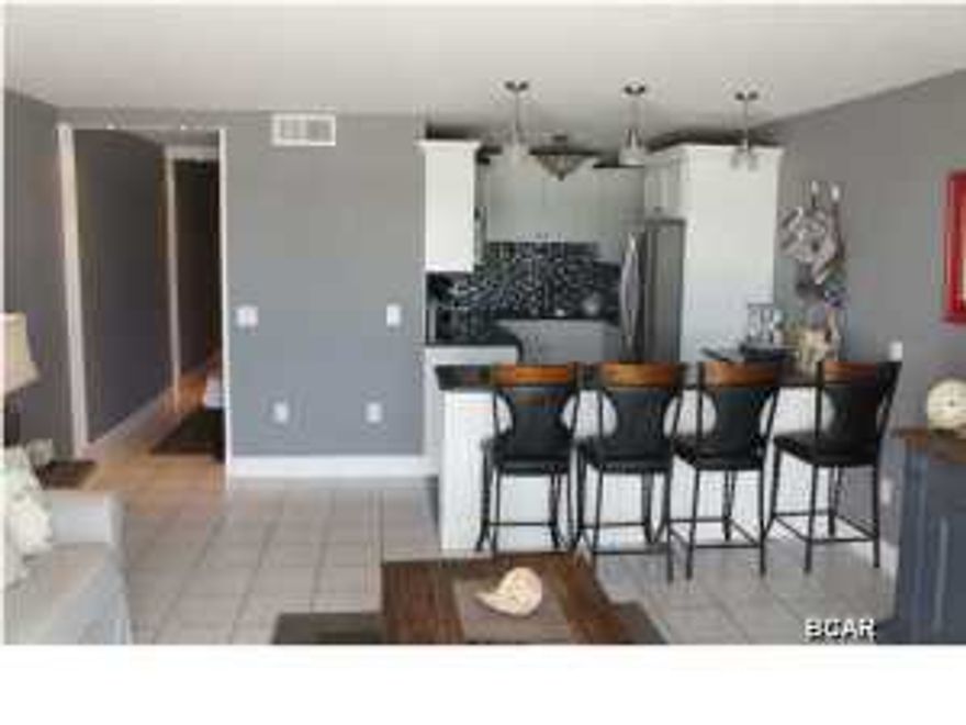 COMPLETELY REMODELED 1 BEDROOM / 1.5 BATH! $30,000+ IN UPGRADES AND PRICED TO SELL! NEW FURNISHINGS! NEW APPLIANCES! NEW HVAC! NEW HOT WATER HEATER. Buyers will be amazed at this condo. The most impressive feature of this condo is the hardwood floors (truly unique color with a premium finish that shines like a diamond). When you walk into this plush condo, look to your left and French doors open to an professionally decorated master bedroom with access to a private bathroom. The hallway has custom bunk beds that were meticulously installed for extra sleeping space. Custom 12x12 tile, granite countertops, Whirlpool side-by-side refrigerator, Whirlpool Gold Series Dishwasher, Whirlpool easy clean stove and oven, premium Elkay sinks, custom kitchen cabinets and backsplash, built in