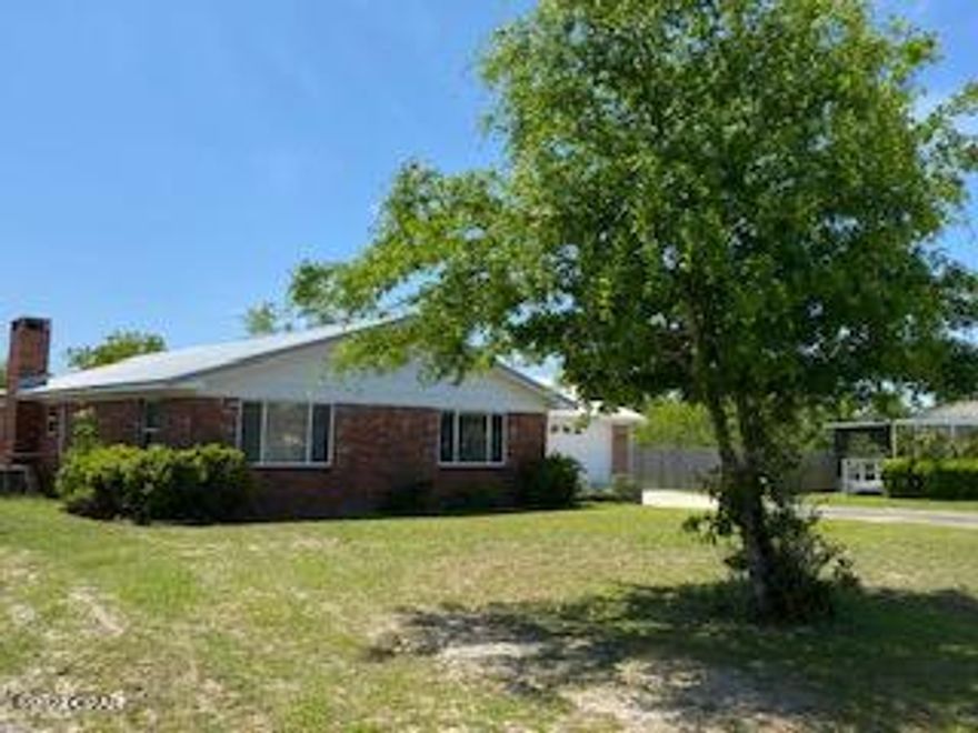 This is a must see! Large home on almost a 1/2 acre with lots of potential. This 3 bedroom, 2 bath brick home has 2 living room areas plus a nice sunroom with two separate spaces. It has a newer metal roof and A/C plus a 13.5x20 shop with a 220-volt electric panel in the back yard. The yard is partially fenced. The 2-car garage is oversized with an access door to the back yard. The large lot backs up to a branch of water that connects to Martin Lake. 

Seller is willing to offer a $1,000 flooring allowance with a strong offer.

Vacant, go check it out!