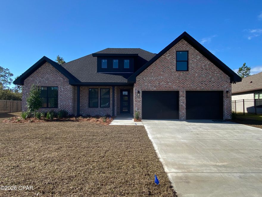 Lovely modern custom home built by David Morgan Custom Homes offers 4 bedrooms, a bonus room with closet and 3.5 baths! This home offers 3000+ heated and cooled square footage!  The open floor plan allows for large family gatherings and entertainment. The living area features high ceilings offering a grand welcome as you enter from the foyer. The entertainment center is customized with an electric fireplace, built-in shelving and modern decorative trim. Just off of the family room is the formal dining room and a beautiful custom kitchen. The kitchen boast modern white cabinets with a stained island matching the shelving and decorative trim on the entertainment center in the family room, white marble tops, upgraded gallery  stainless steel appliances, a tiled backsplash, breakfast nook and a pantry. Ideal split bedroom floor plan, the master suite is downstairs and offers many upgrades including step up ceilings, custom trim, his and her closets between the master bedroom and bath. The master bath offers a large walk-in shower, a free standing tub, a private water closet and double vanities with marble tops. There are two other bedrooms downstairs that share a large full bath that offers a tiled tub/shower combo and double vanities. The half bath for guest and the  laundry room is just off of the family room. Upstairs, features a large 4th bedroom with a full bath and walk-in closet as well a bonus room over the garage that can be used for a 5th bedroom as it also has a closet. The large back yard allows for many great outdoor landscaping ideas! 
There is also a sprinkler system, screened in back porch and a 2 car garage! NO HOA FEES!  Cozy neighborhood within the College Point area just off of HWY 390. There is a lovely neighborhood park at the end of Harvard with a playground, a covered pavilion and an area to to fish, kayak, you name it!  Great location, approximately 5 mins to shopping and great schools, 20 minutes to TAFB and about 20 minutes to Panama City Beach! Builder warranty included! Current construction status, home is completed and adding final touches, home and construction cleanup, landscaping in progress. *Updated professional pictures soon! Don't miss this one!