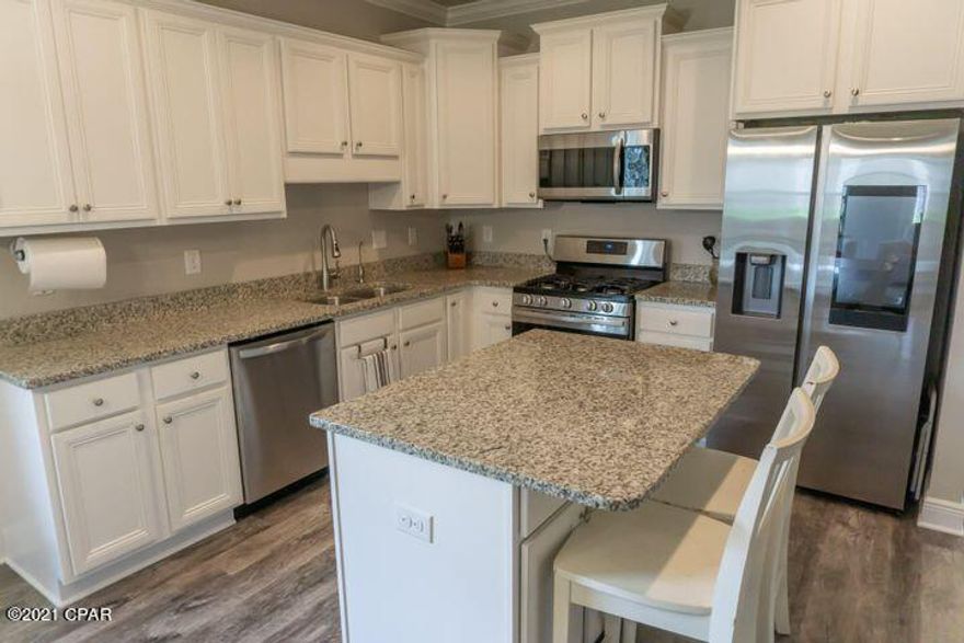 Welcome home to Hammock Bay-Central Park! Features: 3 brick sides and hardy board front, gas water heater, gas stub for grill, granite countertops in kitchen & baths, tile shower in master bath, flex room at the front entrance, stainless steel dishwasher, fiber internet with direct connections in all rooms, carpet in bedrooms only and sprinkler system with underground well and rust preventative tank.  Upgrades: Samsung 5 burner gas stove, Samsung Microwave, Samsung Family Hub Smart Refrigerator with ice maker, Whole House water softener system.  Reverse Osmosis with Remineralization at Kitchen sink connected to refrigerator, ceiling fans in all rooms, Lawn Doctor Service, partially fenced yard, ADT system with window sensors, doorbell camera, garage tilt and a Transferable Termite Bond!