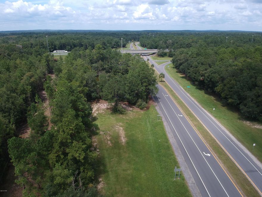 AWESOME LOCATION! almost 3 Ac Zoned commercial, that approx 800 feet of highway frontage, 6 lots total, Just off Interstate 10 right across the street from State of Florida rest area, 3 gas stations and a hotel. Nice traffic count at this I 10 exit #96. Paved area for parking already there. This would make a great location for a Dollar General, or a fast food place like McDonalds, Burger King, Hardees. Or a business office that wants to be centrally located between Tallahassee and Pensacola. You wont find a PRIME real estate location just off an interstate for this price. An Investor might pick this up and hold as this area continues to grow!!  PI# 1834.02-001-013-001.000, 1834.02-001-017-001.000, 1834.03-001-020-001.000 and 1834.03-001-020-002.000