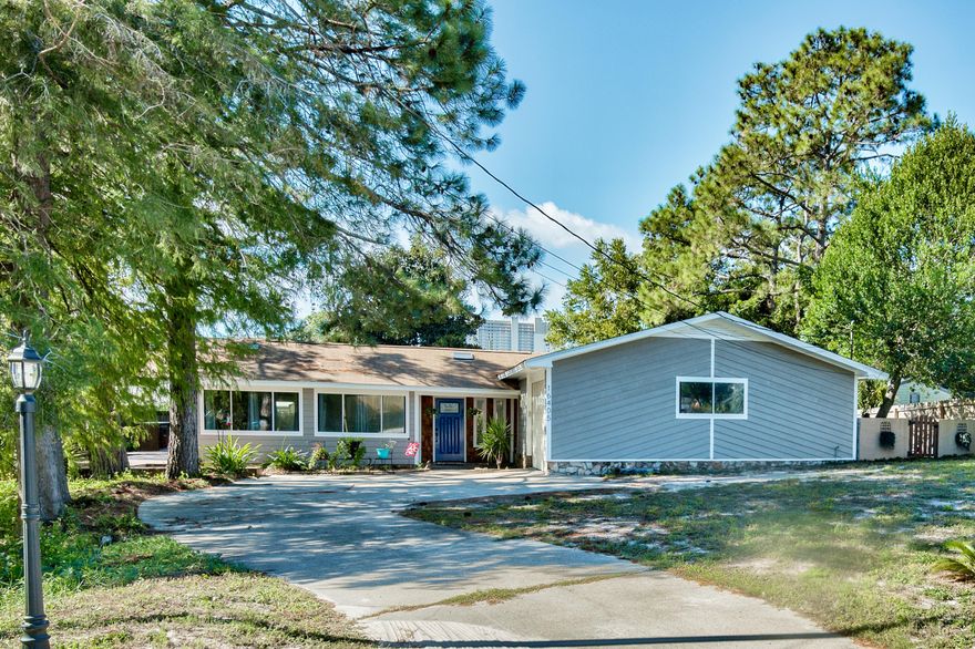 Open floor plan, two large bedrooms, attached garage, new kitchen cabinets, countertops and appliances, new hot water heater & HVAC, great covered deck and nice sized corner lot.