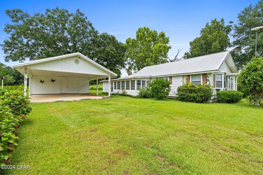 CURRENTLY UNDER CONTRACT, SELLER WILL CONSIDER BACKUP OFFERS 
This farmhouse is sitting on over an acre of serene countryside. Offering 2 bedrooms, 2 bathrooms, and 2 sunrooms, this home showcases its vintage appeal. The main part of the home was built in 1927, but the sun rooms, laundry, bathroom+sitting room were added in 1999. Enjoy the convenience of indoor laundry, 2 dining areas, a den, and a spacious kitchen with lots of cabinetry. The kitchen has new floor covering and the home also has a brand-new electric water heater. 

Outside, a 32x24 2-car carport on a slab offers ample parking space with an attached storage room and overhead attic storage. More storage is provided by a 12x20 shed with a slab foundation and another smaller shed. Entertain guests under the gazebo in the fully fenced yard with 2 gates that ensures privacy and security for everyone. For the pet lover, there is also a 12x28 kennel house, complete with electricity and 7 kennels. This home is located down a quiet, county-maintained dirt road in the country not too far from town. The home is in overall good condition, but it is an older farmhouse that hasn't had a lot of updates over the years, except the additional square foot that was added in 1999. With some TLC you could transform it into your home! If you like country living and also being about an hour from Panama City Beach then this property is perfect. Cash or Conventional only- NO FHA, USDA, or VA loans will be considered due to the house not being in qualifying condition.

Note from the seller: Motivated seller looking to move this house. The nucleus of the house was built in 1927 but has modern up dates the sun room coming into the house has all been added new has low E impact windows and very spacious room. Then coming into the house is the fireplace room which is supplied by gas and has new ceramic logs and remote to fireplace. This house also has a lot of potential to add and create bedrooms easily. My grandparents owned this house and unfortunately was there time to pass on they left me the house the short time I have spent out there I can tell you it is very peaceful. You have a active cow pasture where she turns them out every morning and her grandson lives just next door. I put a fence and a barn in after hurricane Michael this house suffered zero damage from the storm the house is move in ready but the good thing about this house is you can make it your own at the price I'm selling it for. And if you think it's to high make me a offer nothing is off the table I am willing to negotiate.Also your not that far from Panama City Beach and Pier Park with excellent restaurants and shopping.
