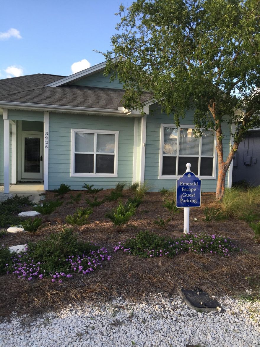 CURRENTLY UNDER CONTRACT, SELLER ACCEPTING BACKUP OFFERS Adorable 3Br/2Ba beach cottage with screened in back porch and single car garage.  Walk two blocks to the beach with public access. Crown molding throughout, granite countertops, new ss appliances, master with walk in closet, all baths with granite. Renovated with upgrades fresh paint inside and out in 2017. Professional low maintenance landscape with sprinkler system and privacy fenced back yard.  Plantation blinds throughout home with tile floors and engineered hardwood for easy maintenance.  Extra parking for family and friends.