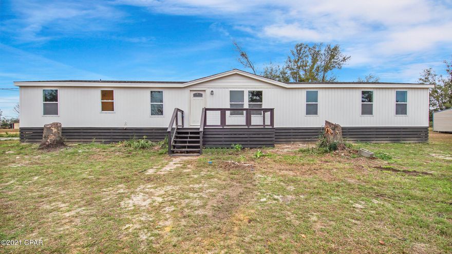 A-MA-ZING!!!! Beautiful manufactured home on 1/2 acre about 15 minutes from town! This home has been lovingly restored and features a living room, family room with electric fireplace, huge kitchen with new soft close cabinetry, pantry, stainless appliance package, quartz countertops, split floorplan with a HUGE 25 foot long master bedroom - it's just enormous! Large walk-in closet with custom built-ins and shiplap accent wall, bathroom with double vanity - solid surface countertops, freestanding soaker tub, oversized shower.  The other bedrooms are on the other side of the house and are very spacious. Great closet space throughout. Large walk-in pantry behind the laundry room. Special custom touches throughout. Special custom touches throughout. New windows, new doors, new HVAC... All you see is new! Don't pass this one by! All sizes approximate and taken from public records, buyer to verify any details buyer deems important.  Seller has not occupied the house - renovation has just been completed.