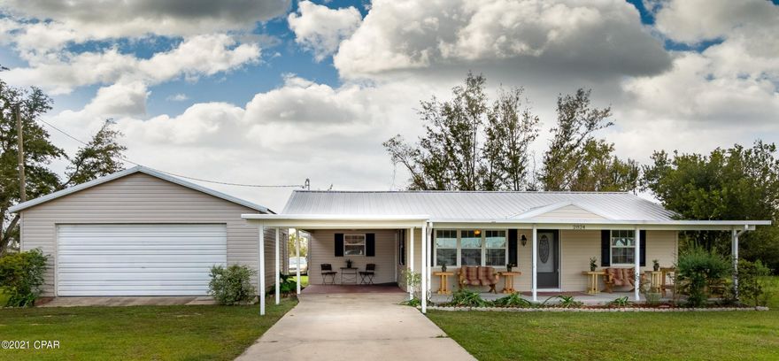 CURRENTLY UNDER CONTRACT, SELLER ACCEPTING BACKUP OFFERS If you're searching for space take a look at this charming home! This block home has been updated with vinyl siding and is centrally located to just about everything in town. There are 4 bedrooms and 2 bathrooms in the main house, plus a guest house in the back with its own bathroom. The kitchen has beautiful wood cabinets with granite countertops and plenty of sunlight. The home sits on half an acre on a quiet road, and has a huge covered front porch that's perfect for enjoying your morning coffee. This home has so much to offer and so many different possibilities. Make sure you check this one out today!