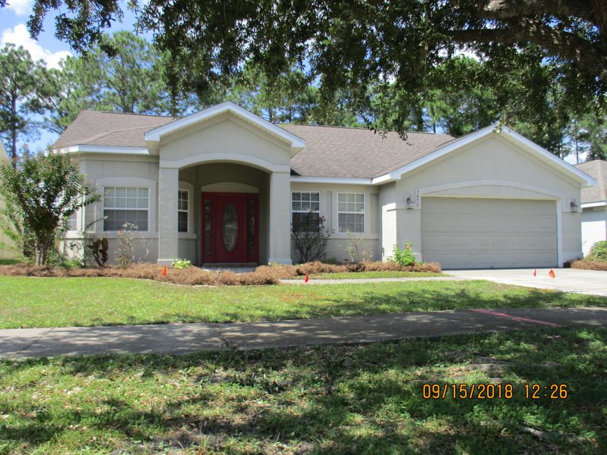Centrally located in a great subdivision The Hammocks.  3/2 Open floor plan . Enter the tiled foyer into a large living room with a built in desk area and sliding doors leading to the covered patio and privacy fenced backyard.  Engineered wood plank flooring flows from the foyer through the living room and roomy dining room and hallway.  Fully equipped kitchen with new stainless appliances, plenty of cabinets, pantry and breakfast area.  Open  arch allows interaction with the living room  activities.  Generous space in Master bedroom, large master bath features  separate tub and shower,  double sink vanity and his and her closets.  Two  additional ample spaced bedrooms and full bath.   Amenities include a community pool. Subdivision  located near schools, shopping , medical clinics and restaurants. Everything  you would need.