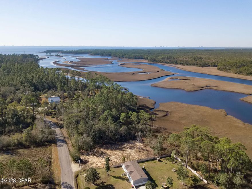 PRICE ADJUSTMENT!  This beautiful waterfront lot has been cleared to build the home of your dreams.  This property backs up to a beautiful marshy area (not deep water) giving access to West Bay and to the Gulf.  Conservation area borders the south side of the property so no one can build on that side.    Property is surveyed and dock to the water is allowed (permits required).  Complete environmental report.  The Burnt Mill Creek public boat ramp is just down the street too!  Flood Zone AE.  Well and perc test/Septic will be needed to build.  Environmental Development report is in the documents.



Close to ECP airport, West Bay and the Intercoastal Waterway.