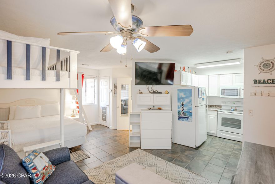 Discover one of the best beachside values in Panama City Beach—a rental-ready studio just steps from the sand. Located in Sand Castle Villas, this beautifully maintained and fully furnished studio condo is truly turnkey and ready to generate income from day one. With custom built-in loft beds, a luxury main sleeping area, and a smart, space-efficient layout, the unit comfortably sleeps up to 7, making it especially attractive for short-term rental demand. This condo is one of only two units in the entire complex featuring a rare U-shaped kitchen, offering extra cabinet and counter space—a standout feature for guests and owners alike. The kitchen is fully stocked and features all white appliances, while tile flooring throughout, serene coastal tones, and tasteful décor create a bright, inviting beach retreat.
Enjoy less than a one-minute walk (approximately 150 steps) to the white sugar sands and emerald waters via Beach Access 13 and 14. The complex is well known for its strong short-term and long-term rental performance. Additional highlights include: Private fenced pool and outdoor shower,
Private laundry room just outside the unit with washer, dryer, and extra storage, one assigned parking space plus overflow parking, and balcony space to relax and enjoy the coastal breeze.
Peaceful, smaller complex with a personable, laid-back atmosphere, Close to restaurants, shopping, and a short drive to Pier Park. Whether you're looking for an affordable personal beach getaway, a high-performing investment, or both—this studio delivers exceptional value, charm, and income potential under $150K in today's market.