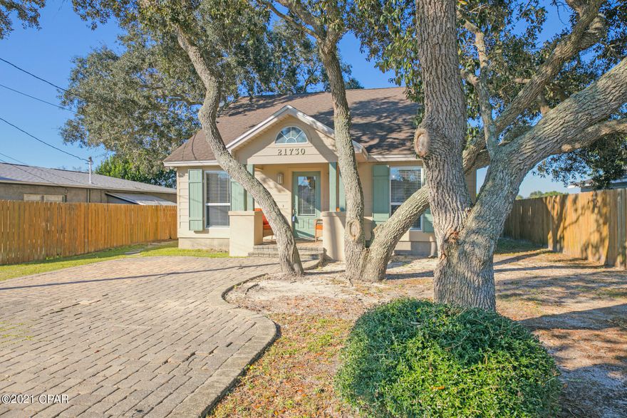 CURRENTLY UNDER CONTRACT, SELLER ACCEPTING BACKUP OFFERS' From the Moment You Drive Up, the Beautiful Oaks and Paver Parking Will Capture Your Heart! With Unique One of a Kind Architectural Design, This Custom Home by Nolan Roussel Distinguishes Itself From the Rest. The Spacious and Open Plan Flows Beautifully Allowing Plenty of Room for Entertaining as Well as Affording Privacy Through a Perfectly Designed Split Bedroom Arrangement. Much Thought Has Been Placed on Utilization of Space With Ample Storage, Built In Book Cases and Entertainment Center in Living Area and Uniquely Designed Architectural Shelving and Niches Throughout. The Well Designed Kitchen Has Glass Mosaic Back Splash. And, the Large Island With Decorative Lighting Above Provides The Light and Warmth of the Master Bedroom Presents An Invitation of Relaxation and Quietness and Becomes a Retreat in Itself. With Over 15' Linear Feet of Closets You Will Again Be Amazed at the Well Planned Space of This Home. The Master Bath Features a Jetted Spa Tub, Separate Shower, Vanity with Dressing Area, and a Beautiful Custom Window Balanced Above an Architectural Niche. With Two Sets of Double French Doors, One From the Living/Dining Area and One From the Master Bedroom, You Can Easily Bring the Tranquility of the Outdoor Living Space Inside. Both Open to an Outdoor Living Area and are Shaded by Beautiful Oak Trees in the Fenced Back Yard. There is Also a Wonderful 10' x 10' Wired Outdoor Storage Building, Custom Built to Match the Home. Also an Underground Sprinkler System in Both the Front and Back. High Ceilings, Good Cents Construction, Cement Board Siding, Dimensional Shingles, Lots of Crown Molding. And For the Best of All Worlds........You Are Just a Short Walk to Our Beautiful Sugar White Beaches Or a Short Drive to Pier Park or 30A!! Don't Miss This Opportunity. Once You Have Seen It.....You Will Want To Stay Forever!!! If Details or Dimensions are important to you, please verify.