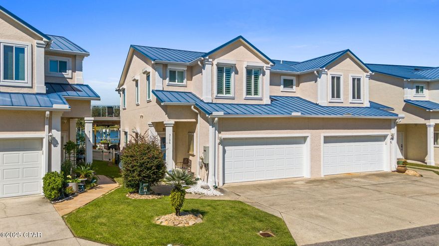 Gorgeous waterfront townhome with boat lift and brand-new jet ski lift!  Don't miss this beautiful home just minutes from Tyndall Air Force Base and a quick 15-minute boat ride to Shell Island.  The two story 3 bed, 2.5 bath townhome has amazing water views from the living room, kitchen, dining and bonus room.  The house has been beautifully remodeled to include a new kitchen with Quartz countertops, new soft close cabinets with pull out shelves, tile backsplash, copper farmhouse sink, built in wine refrigerator, fingerprint resistant black stainless-steel appliances, gas stove and custom lighting.  There are tile floors throughout the home. Highlights include a ventless gas fireplace, wood plantation shutters, thermal windows, 40-year metal roof, newer downstairs sliding door with built in blinds, new upstairs patio door, 2 new HVAC systems in 2018, new water heater in 2019, fully re-painted inside and out, Generac whole house gas generator, ADT security system and electric hurricane shutters.  Downstairs is an open floor plan with lots of light coming into the living room/dining room/ kitchen area, a half bathroom, laundry closet and great storage under the stairs. Upstairs are two guest bedrooms with one having a bonus 10 x 12 area perfect for a reading nook, and an expansive master bedroom that has a 10 x 20 bonus room off of it perfect for a home office/flex room. The master bathroom has a soaking tub, two vanities and a walk-in shower. There are barn doors for the bonus room and master walk in closet. The outdoor spaces are the highlights of the house. The upstairs deck is a great place for evening cocktails, dolphin sightings and catching the gorgeous sunsets! The downstairs slip resistant textured deck is a great place to lounge in the two chair swings, cook out, sit at the bar that is the length of the deck and enjoy watching the boats going by. There is a shade to pull down during the heat of the day. The backyard is fenced in for pets with a double gate so the lawn maintenance crew can still get in to mow. There is a rack system to hold kayaks. The boat lift motor was replaced in 2019, and the jet ski lift was just recently replaced. The property line extends to the water and there is an area to put in kayaks, as well as a bridge to enter the water on foot. A key asset to the community is that there is a large HOA owned dock. The water is 8-9 feet so it can easily handle most boats. The dock was rebuilt in 2019 and has power, water, lights, ladders and a fish cleaning station. You can even jump into the water from the dock for a swim. The HOA fee is currently $215 per month and includes all lawn care for the home and common areas, trash pickup, sprinkler systems for the community, electric to the dock and the dock maintenance. The location is close to Pier 98 Marina to gas up the boat and get bait and Rodeo's Steakhouse restaurant is within walking distance. Many of the neighbors are military or retired. The property is in an AE Flood Zone so flood insurance is required. The seller has a survey and elevation certificate and currently pays $1,100/year for flood insurance while Homeowners is $3,755/year. There is guest parking at the entrance to the neighborhood and at the end of the complex. There are no restrictions on rentals so the property could be used for short term rental. Make your appointment to see this gorgeous, hidden gem today!