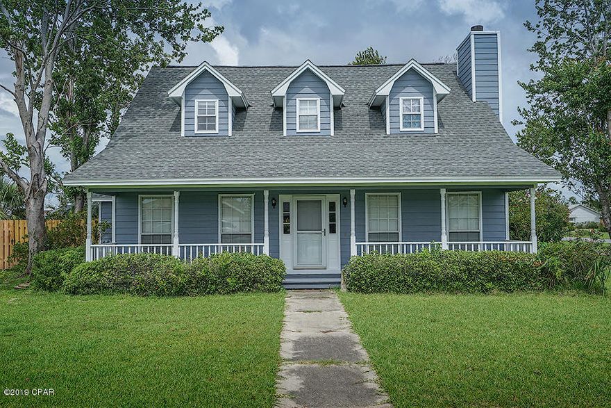 2111 Pentland Road, Mowat Highlands, Lynn Haven, spacious corner lot, the house is modeled after a Cape Cod home with 3 bedrooms, 2.5 bathrooms, split floor-plan and many upgrades! Features - New Roof with 50 year warranty through GAF, New Exterior Paint, New Fence, Corner Lot and plenty of character. Kitchen has quartz counters and gas stove. Wood and tile flooring and a very large master suite and master bathroom with walk-in closet, double vanity and separate tub and shower.  2 bedrooms upstairs w/ their own vanity and share a shower between. A covered porch extends across the entire front of the home and the backyard is privacy fenced with fruit trees and patio for grilling, entertaining and relaxing. Side/back yard offer room for RV, Boat or even a pool! Seller offering a $2,000 carpet allowance with the accepted contract at closing!!