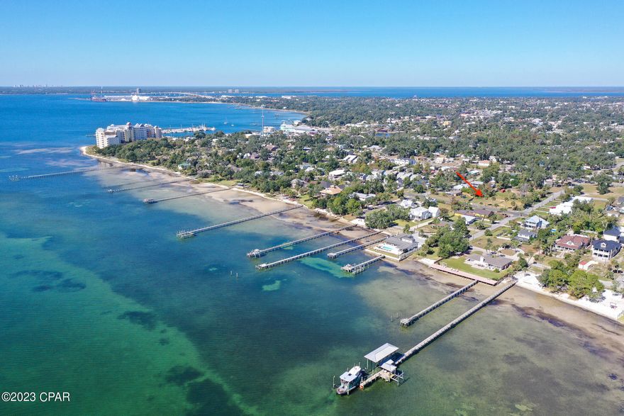 'CURRENTLY UNDER CONTRACT, SELLER WILLING TO CONSIDER BACK UP OFFERS.' Prime opportunity to build your dream home one block from the beautiful blue waters of St. Andrews Bay in Panama City. This parcel has been cleared, has private alley access, and has undergone complete soil testing. There's a certified survey available along with an elevation certificate and a new curb driveway. This highly sought-after community also offers sidewalks throughout. The lot is a short walk and only a block away from the public beach and sitting area by the bay along Beach Dr. Super close to everything the St. Andrews area has to offer. Don't delay - this piece of land won't last long!