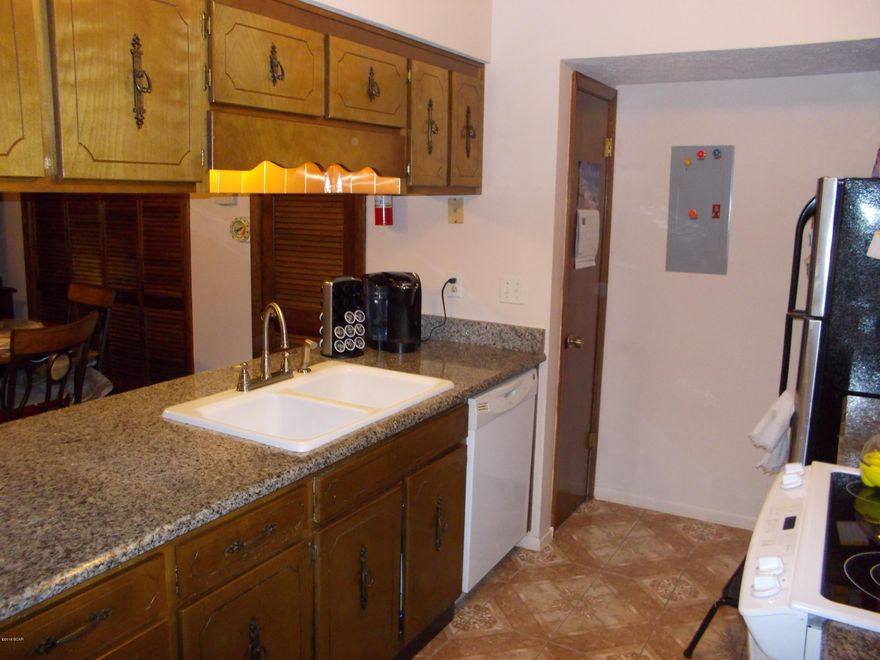 Well maintained 2 bedroom 1 and 1/2 bath, town home in Callaway. If you are unsure about a two story Townhome this one is equipped with an Acorn Stair Lift. Close to shopping and only 15 minutes to Tyndall. Renovated in 2006, new A/C, new Roof, new Elastomeric Paint, new wood style ceramic tile, and granite counter tops. lots of storage. All appliances convey. 10 x 12 work shop, with electricity, bench and A/C unit. Fenced back yard. all of this for only $67.00 dollars a sq. ft.  Seller says sell. sell. sell.