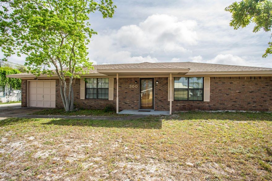 Priced to sell!!     Located conveniently off North Lagoon Drive.  This all brick house is on a large corner lot, has an oversized covered deck which is great for entertaining.  This house is convenient  to marinas, lagoon and beaches.  This two bedroom, two bath North Lagoon Heights house has a sunken living room, fireplace, breakfast bar, dining room and great potential.  Make this your dream beach house.