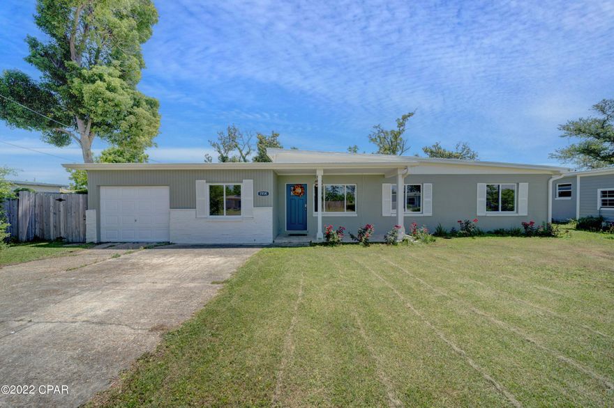 Beautifully updated solid block home in the popular St. Andrews area with an inviting landscaped/fenced-in back lawn and patio for entertaining. The interior has a coastal flare throughout the over 2000 sq ft boasting 4 BR's/2 BA's, 2 living areas, and gorgeous kitchen with custom upgrades PLUS a bonus room for a 5th BR, office or mancave! Remodel included NEW electrical, water heater, HVAC, stove/oven, stainless appliances (fridge, microwave, washer/dryer CONVEY with the sale), walk-in pantry, farm sink, custom cabinets/countertops, barn doors, exterior doors, windows, paint, flooring, shiplap, fence, and MORE! Updated workshop and separate well/irrigation system for the lawn.