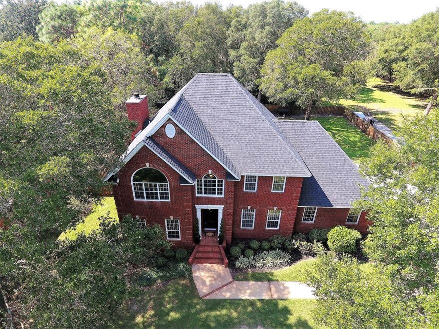 Located in one of the most sought after communities in Panama City, this Kings Point home will surely impress. All brick, 3,100 square foot, 3 bedroom, 3.5 bath home 2 car garage is nestled on a beautifully landscaped 1/2 acre lot. 

The interior of this home is even more impressive than the exterior!  The home was completely remodeled in 2008 and the architectural elements, design features and fixtures chosen during the remodel keep this home looking timeless.Covered patio has a spacious granite countertop bar with sink and ample storage and provides plenty of counter space to enjoy a family meal outside or provide the perfect spot for any backyard party.Yard is perfectly manicured and the backyard is fully fenced with a gorgeous brick entrance and perfect for future pool or entertaining.