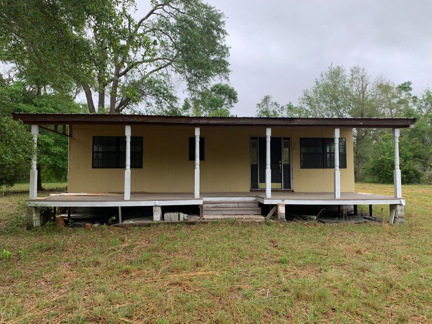 Private Getaway! 8.37 Acre 2Br 1Bath 1375 Sq. Ft. home on a private spacious lot.  This home is nearly complete with new appliances, hot water heater, HVAC system and fixtures, just waiting for you to pick the flooring.  This house features an open kitchen, dining and living area with two spacious bedrooms and plenty of closet space.  A recent survey can be provided showing the division of the 8.37 acres into lots 2-7, which can be used to subdivide the larger parcel for investment.  This property contains a nice block building with attached carport for a workshop or storage.  Known for its wild game, you can sit back and relax on the spacious front porch and watch the wild turkeys trot by.  Make an appointment today to take a look and see what this property has to offer.