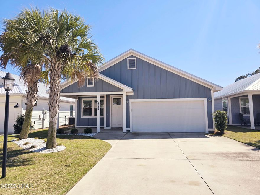 Discover the charm of coastal living in this meticulously crafted 2021-built Hidden Cove home in Panama City Beach. Spanning 1,659 square feet, this residence offers three bedrooms, 2.5 bathrooms, and elegant living spaces enhanced by tray and nine-foot high ceilings, complemented by durable vinyl plank flooring throughout.

The kitchen is a chef's dream with quartz countertops, a spacious island, and top-of-the-line stainless steel appliances. Enjoy the ambiance of tongue and groove ceilings on both the front and rear patios, alongside a resilient metal roof and city water and sewer services for added convenience.

Living spaces extend seamlessly to a screened-in porch that overlooks a large fenced backyard, perfect for playing with family and furry friends. The backyard also features a state-of-the-art irrigation system. Each full bathroom boasts double vanities, while the master suite includes a generous walk-in closet.

Additional highlights include a spacious two-car garage, energy-efficient double-pane windows, and a community with underground power and sidewalks. Located just minutes away from one of the most beautiful beaches in the world and everything Panama City Beach has to offer, this home epitomizes the perfect blend of comfort and coastal convenience.