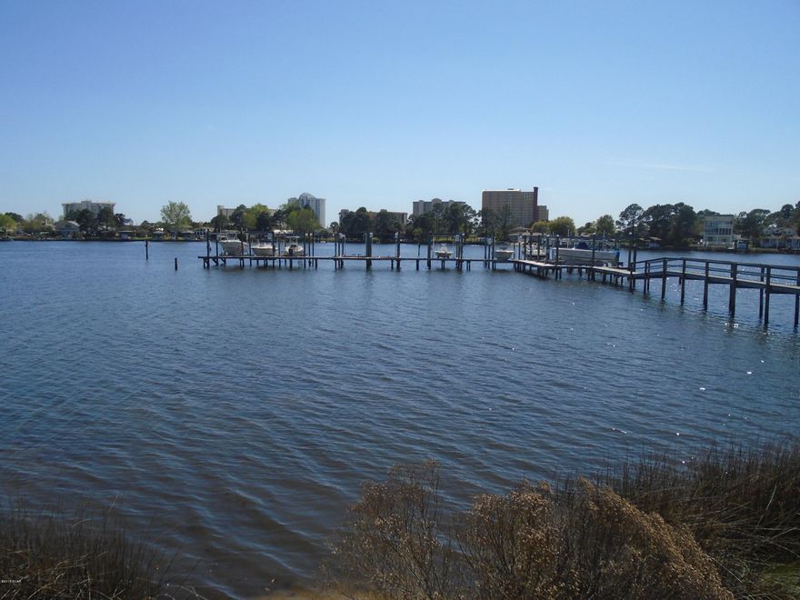 Great house in a great community.  This home has all hardwood floors and tile.  Each bedroom upstairs has an attached bathroom.  Downstairs master.  Community Pool overlooking the Lagoon.  Beautiful sunsets and great fishing.  This unit comes with a boat slip and a lift.  Community club house.  Metal roof.

Lagoon leads to Gulf.  Very low HOA fees only 240 a month.  This house is a must see.  JenAir stove with large kitchen and lots of cabinets.