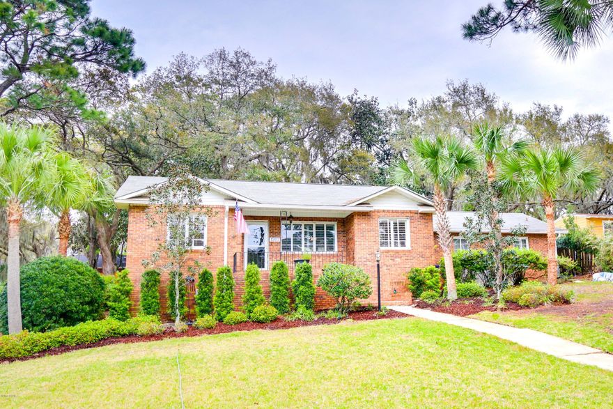 Beautifully restored Cove brick home sits high and dry on a nicely landscaped lot.  Parking is in the front for guests and the garage and driveway parking is from the rear of the home.  Original red oak floors have been sanded and re-stained throughout the home.  The chef's kitchen has been upgraded with an $8000 appliance package including a gas stove, convection microwave, and stainless side by side refrigerator.  Brick patterned large ceramic tiles tie the kitchen in to the rest of the home.  There is an adjoining room to the kitchen that makes the perfect pantry or breakfast room.  Formal dining room and a large family room complete the layout.  The family room has exposed beams and a vaulted tongue in groove ceiling, with heart of pine paneling on the walls as well. The bathroom has been gutted and updated with pedestal sink and travertine tiled flooring and shower!  The hot water heater is a Rinnai tankless water heater - providing hot water on demand!  The oversize double garage has an insulated door and closets all around the garage, and a floored attic for all your seasonal storage, and a half bath, giving the new owner expansion opportunities.  The driveway is large enough to park a pontoon boat and other vehicles.  Important dates - Roof was replaced in 2010 and the flat roof was recently redone as well.  All brick exterior, new fans throughout, and added insulation make this a very energy efficient Cove home, all controlled by a Nest thermostat - controllable on your cell phone.  The yard in the back has a new privacy fence, and gutters have been installed by this caring owner.  All window treatments stay for the new buyer.  There is a slight view of the Bayou just across the street, and you are also very close to the walking park on Cherry Street, and Cherry Street Elementary.  Please call your Realtor today to see this great home - move in ready!