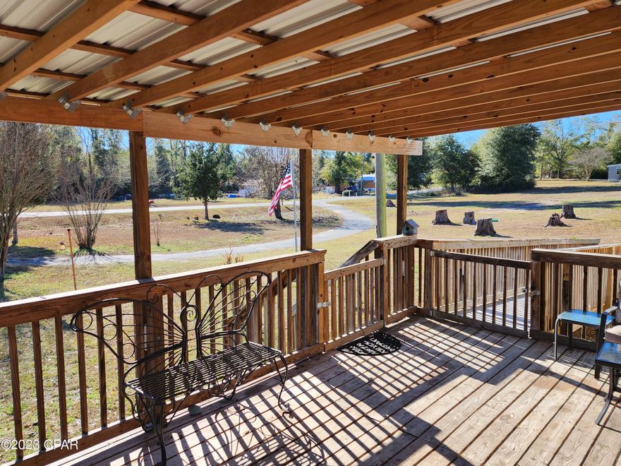 Are you looking to move out into the country?  Older single wide mobile home being sold AS/IS with some furnishings included.  Mobile home needs some work but sits on approx 1.3 acres with large circular driveway.  Front covered deck with ramp.  Newer well and newer HVAC system.  Rear of property borders large agricultural farm.  Dead end paved street right off 90.  15 minutes to Walmart, Lowes and other shopping and dining in Marianna.