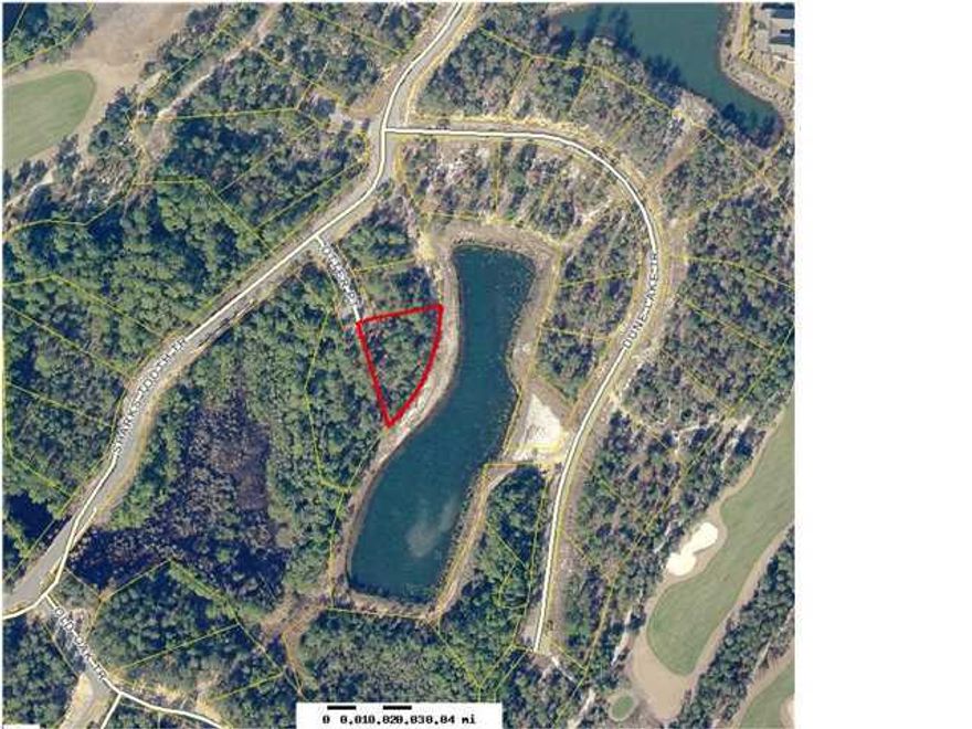 Premier Lot with 260' of sandy shoreline on a beautiful pond in Wild Heron. Estate size lot with 0.49 acres measuring approximately 158' x 260' x 208' on Otter Point. Excellent location convenient to clubhouse and neighborhood amenities at Prospect Point. Amenities include pool, hot tub, fitness center, boathouse with canoes and kayaks for residents use, boardwalks and fire pit by Lake Powell, picnic areas, playground, lots of space for bike riding and walking and places to view spectacular sunsets. Wild Heron POA dues are $525/quarter, Wild Heron CDD fees are $1,688/year. Located 2 miles from Rosemary Beach and 30A area and approximately 7 miles to Pier Park.A private secluded enclave close to all the action of Panama City Beach.