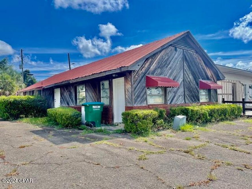 Excellent building previously used as a music studio and man cave. This building has endless possibilities for various types of businesses.   Would make an EXCELLENT Antique shop, music studio, any type of office as the space would allow for more than one business if desired.    Building has been updated within the last few years.  Entire building has newer HVAC system and recently serviced. There is a kitchen area with side-by-side  refrigerator/freezer, double sink, hot plate and microwave.  There is one bathroom.     Most of the things in the building (part of an estate sale) could stay if wanted.  There is a paved parking lot.  Some pretty ribbed metal ceiling in the music room and part of other ceiling.