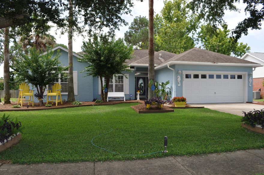 This home has the WOW factor!  This 3BR/2BA Summerwood home boasts tons of upgrades inside and out.  The floor plan is split-bedroom and features  hardwood floors, chair rails and crown molding, 3M Scotch tinted windows, cathedral ceiling, skylights, two fireplaces, and built-in bookshelves.  The kitchen is quite lovely with brand new stainless appliances, granite counters, custom cabinetry, and a pot rack above the center island.  Just off the breakfast nook, the French doors open to a Horizon sunroom that overlooks the backyard.  The Master suite includes a bay window and an en suite with double sinks, walk-in closet, garden tub and a separate shower. The backyard is an oasis with a multi-level deck and gorgeous landscaping that includes Blood Orange and Honey Tangelo trees. To help keep everything healthy and green, the sprinkler system is on a deep well and it will save money on your water bill.  Another huge plus...roll down hurricane shutters for all windows!   The home was recently painted with Elastomeric paint and the front yard landscaping looks like it belongs in a magazine!  You're just around the corner from the beach and Pier Park and Summerwood has sidewalks and a community pool.  All info is approx. and must be verified by Buyers if important.