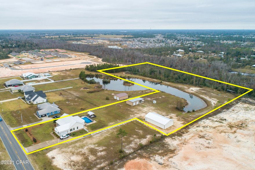 Beautiful 3 bedroom, 2 bath custom home sitting on over 8 acres of land not far from town! Lots of perks to the property including a pool with a covered back porch, fishing pond, (2) 1 36X60 workshop and 1 30X55 workshop, new roof installed 2019, new 22KW Gererac home generator, 2 HP deep well and tankless Ranai hot water system. This lovely home is beautifully decorated with an open plan from the kitchen, breakfast nook and the living room. Den with fireplace and a formal dining room giving additional living space. Split bedroom plan, Master Suite offering a sitting area, a nice master bath with closet, separate tub, shower and double vanities. Also a nice laundry room and 2 car garage! Bring the rocking chairs for the covered front porch!! Don't miss out on this opportunity, call today!! Simply a paradise in your own back yard!!  A pool for the summer, 2 workshops to store your tools or toys or entertain a hobby, a fishing pond as well as the property line also backs up to the Bayou George Creek. Great thing about the land is not only do you have plenty of space to run, fish and play, you also have plenty of room for animals, a great space for horses!
