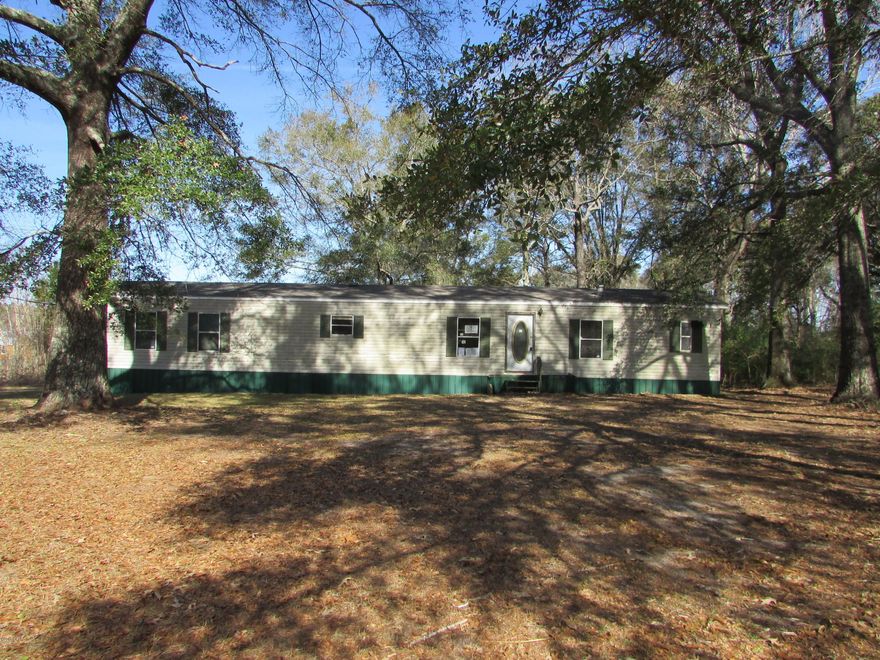 SWMH on paved road. 3 Bedroom 2 bath with 1216 sq. ft on 1 acre! Home needs some work but could be the perfect home with some vision. Call today before this home is gone.