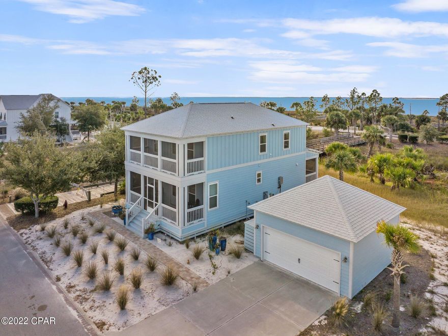 Take advantage of this amazing opportunity to own this beautiful beach home on the most sought-after streets in the Windmark Beach community. Situated on the beach side of Front Street with an above average (.27-acre) lot this property features a boardwalk just off the back screened porch that leads down to the Windmark communities' exclusive beaches. After a day at the beach enjoy your private outdoor shower and relax in over 600 sq ft of outdoor living space with your choice of three spacious screened porches including one private screened porch just off the master bedroom. The interior features quality stainless steel appliances, granite countertops, luxury vinyl plank flooring throughout as well as meticulously selected high quality furniture that will convey with the sale of the home. The ideal location of this home, is just a short walk or bike ride to the zero-entry pool and the thriving downtown corridor that include local cuisine, a pet shop, fitness, beauty and more to come... Call your agent today to schedule a private showing for your new permanent vacation home!