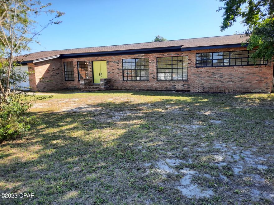 CURRENTLY UNDER CONTRACT, SELLER WILL CONSIDER BACKUP OFFERS! Assumable Loan with a fantastic 2.75% Interest Rate!!! Brick home featuring 4 bedrooms and 3 full baths. There are 3 bedrooms on one end of the home with a mother-in-law suite with its own entrance and full bath at the other end! There are original hard wood floors in the dining room, living room, flex space, hallway and 2 bedrooms. The living room has built-in bookcases for books or to display your heirlooms. The flex space can be a 2nd living room or a den and it features French doors leading to the back yard patio. The windows are large with tons of natural light coming in. The back yard is large enough for a pool and a hot tub can be added to the huge patio! Come see this wonderful home only 10 minutes to Tyndall Air Force Base. All measurements are approximate and if important. please have buyers verify.