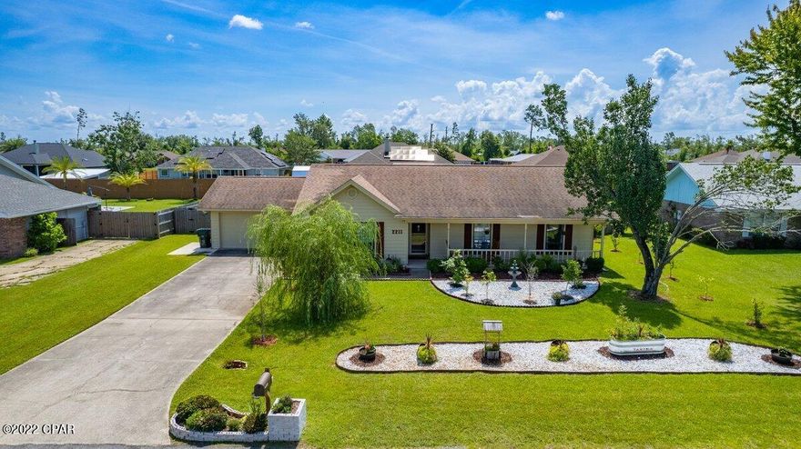 *SWIMMING POOL*RENOVATED* This beautiful 3BR/2BA home is centrally located to many great shoppes, restaurants, and schools. When you pull up to this home you are greeted with a wonderful covered porch that showcases the many gorgeous fruit bearing trees in the front yard. Upon entering the home you will find a large living room featuring vaulted ceilings and an electric fireplace. Past the living room you will enter into the stunning kitchen/dining room which exhibits lots of natural lighting. The kitchen features stainless steel appliances, a breakfast bar, a pantry, and white cabinets. There is a sliding glass door that leads to the covered back patio. You will also find the two car garage adjacent the kitchen. The bedrooms are all a great size and are located down the hallway along with the spare bathroom and laundry room. The master bedroom features two closets and has an en suite bathroom which also conveniently leads to the covered patio. The huge backyard is completely fenced in and features an inground pool and a covered patio. All sizes, ages are approximate, please measure and/or verify if important.