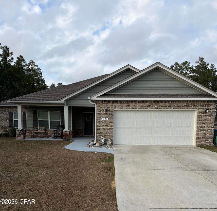 This beautiful 4 bedroom, 2 bath home offers a variety of features to fall in love with! Located just minutes from Lynn Haven, yet far enough away to escape the ''city vibes,'' this property gives you the best of both worlds. Situated on a full ACRE lot cleared of trees and obstructions, you'll enjoy an absolutely stunning yard with endless possibilities. The outdoor space is truly a welcoming; featuring a wonderfully sized pool, relaxing spa, extended patio, and plenty of room for all your toys or future outdoor additions. As you step into the foyer, you're welcomed by a bright, open floor plan with a desirable split-bedroom layout. The kitchen is the heart of the home, featuring quartz countertops, stainless-steel appliances, shaker-style cabinetry, and a spacious island with a breakfast bar. The primary suite is privately situated on the right side of the home, along with the laundry room for added convenience. This room offers trey ceilings, a spacious en-suite bathroom, and an oversized walk-in closet. On the opposite side of the home, you'll find two additional generously sized bedrooms and a guest bathroom. The fourth bedroom provides flexibility ideal for a home office, game room, workout space, or whatever fits your lifestyle best. Whether you're entertaining, relaxing, or just enjoying wide-open space, this home checks all the boxes! Come check it out!